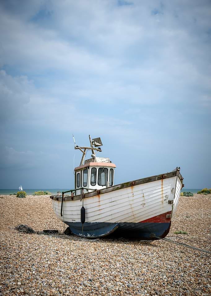 Beached Fishing Boat on Pebble Shore