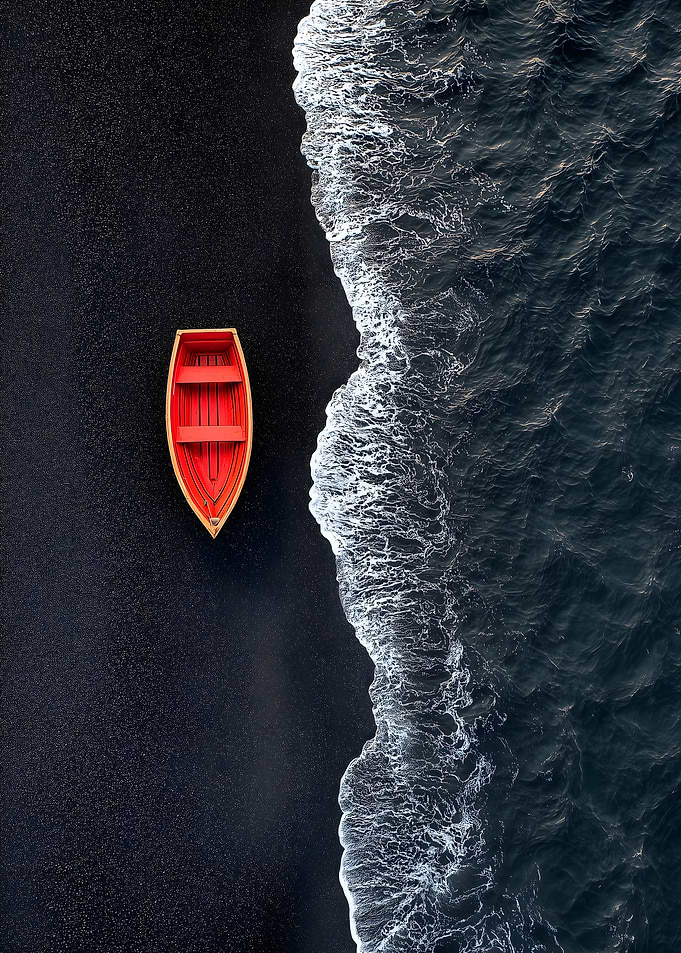 Red Boat on Black Sand Beach
