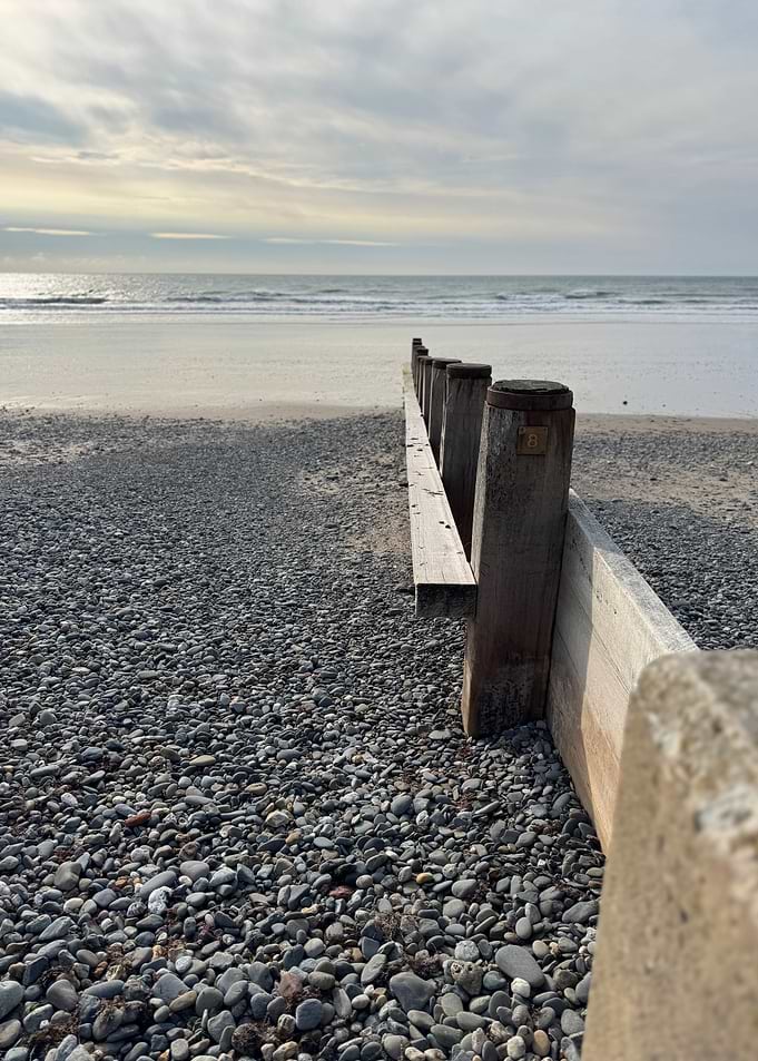 Pebble Beach with Wooden Barrier