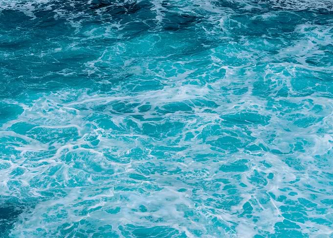 Turquoise Ocean Water with White Foam