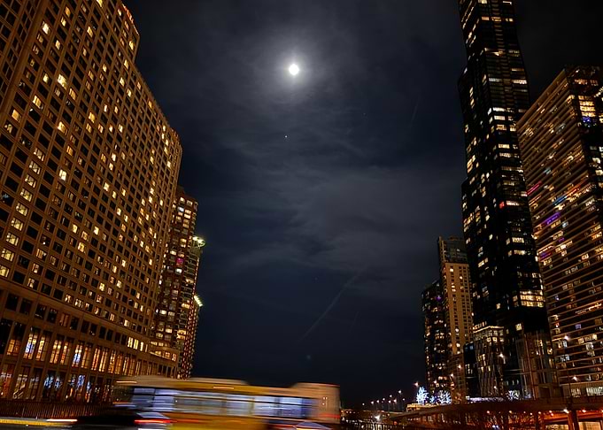 Cityscape at Night with Moon
