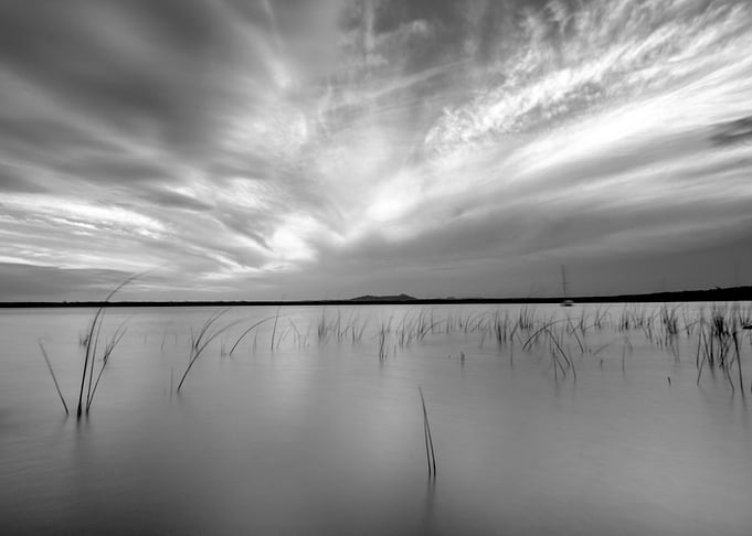 Monochrome Lake Landscape with Dramatic Sky