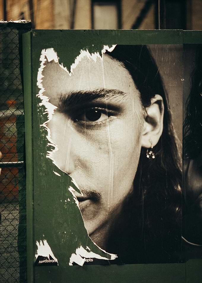 Torn Poster of a Man's Face