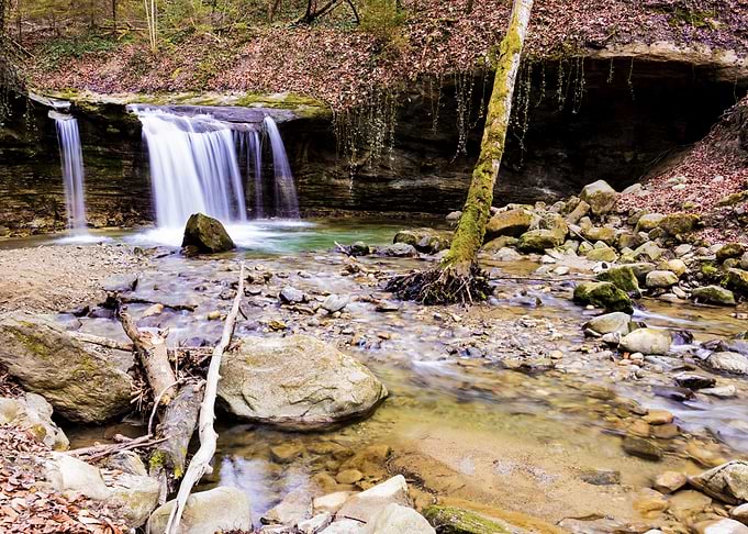 Mèbre River Waterfall in a rocky forest stream