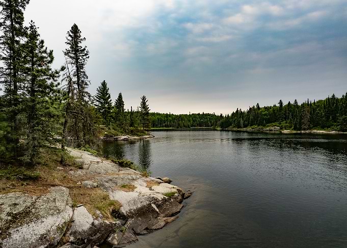 Serene Lake Landscape with Rocky Shore Canada