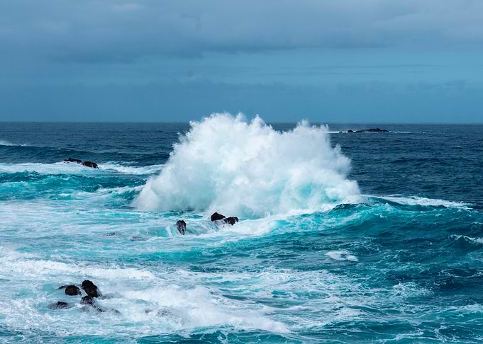 Ocean waves crashing on rocks
