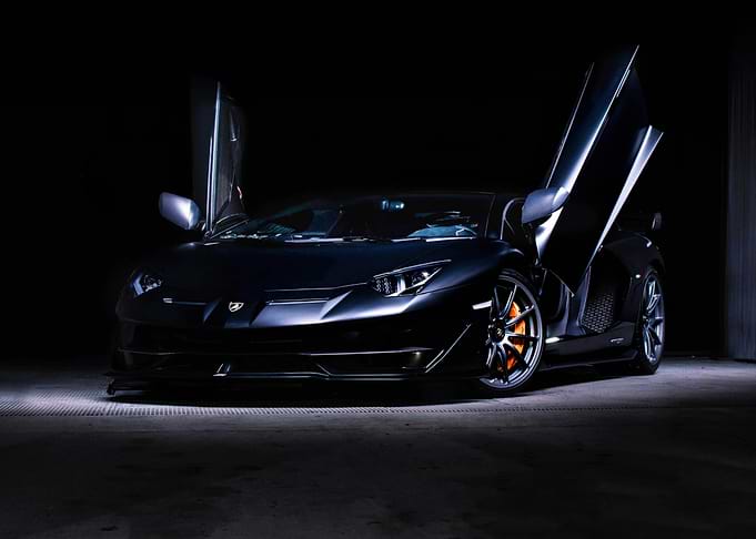 Sleek Black Lamborghini Aventador with Open Doors