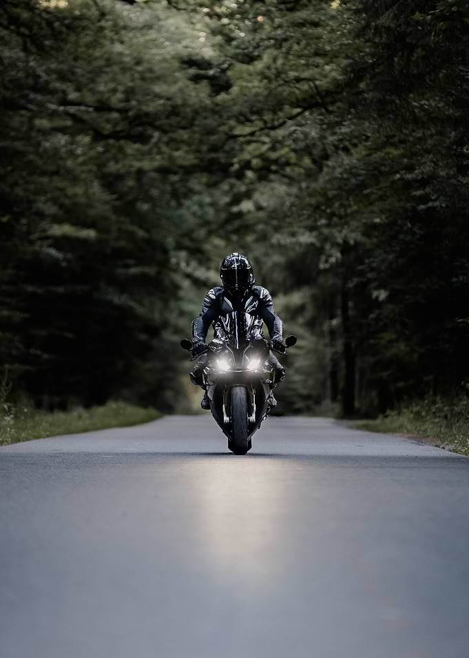 Motorcycle Rider on Forest Road