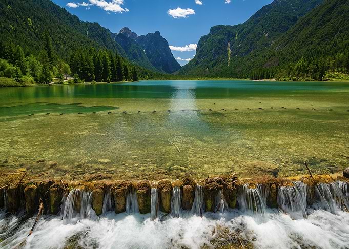 Idyllic Mountain Lake with Waterfall