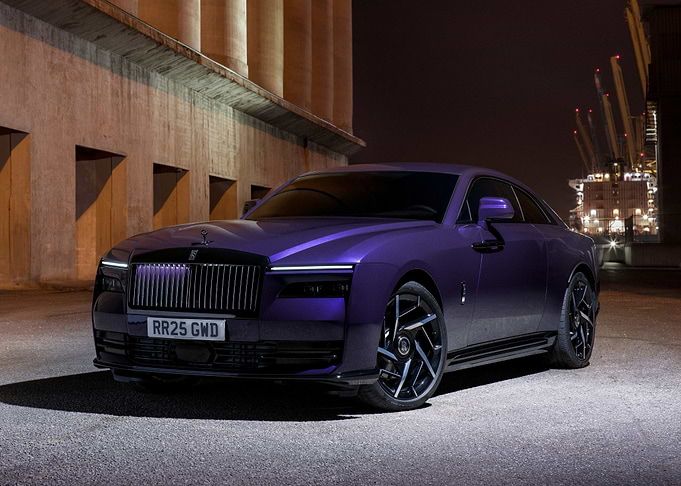 purple rolls royce at night