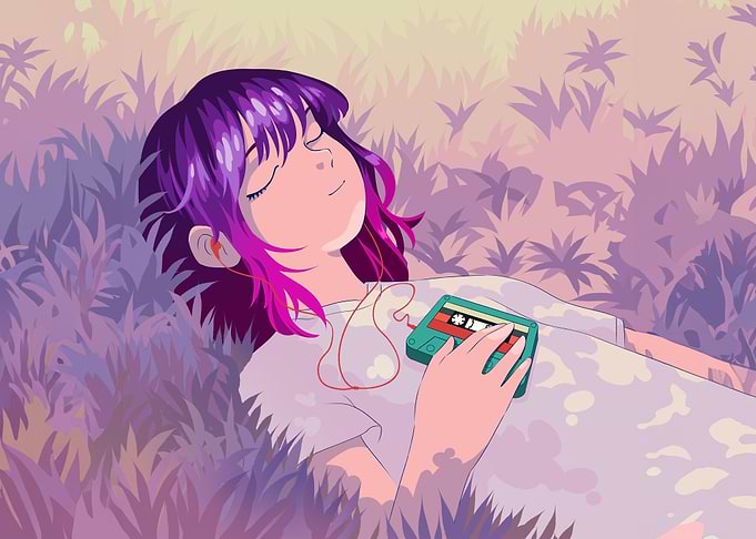 girl listening to music in grass