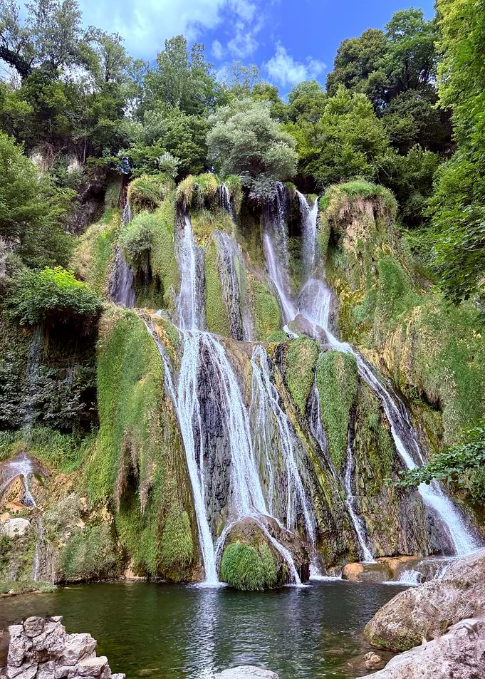 Waterfall cascading down mossy rocks