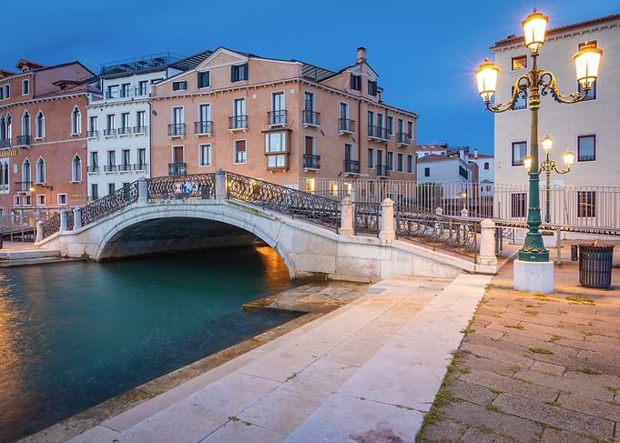 Venice canal bridge at dusk