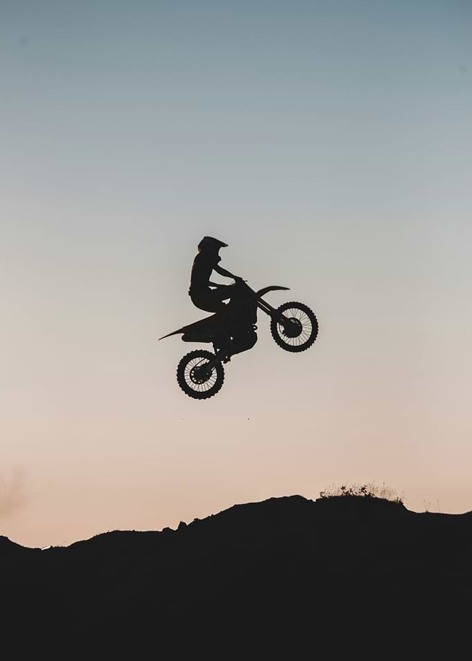Motocross Rider Silhouette at Sunset