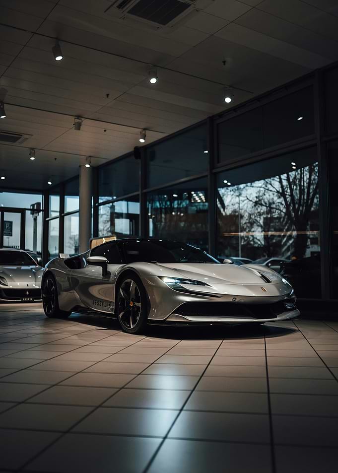 Silver Ferrari SF90 Stradale in Showroom