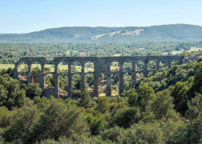 Ancient Aqueduct in a Green Landscape