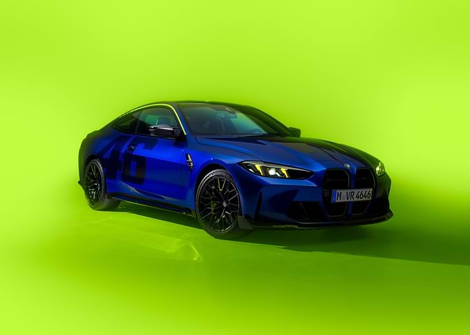 Blue BMW M4 on Green Background