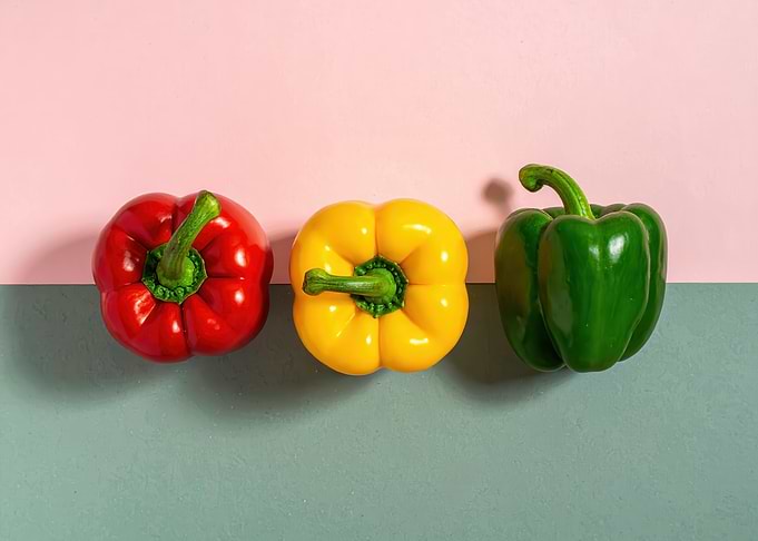 Colorful Bell Peppers on Split Background