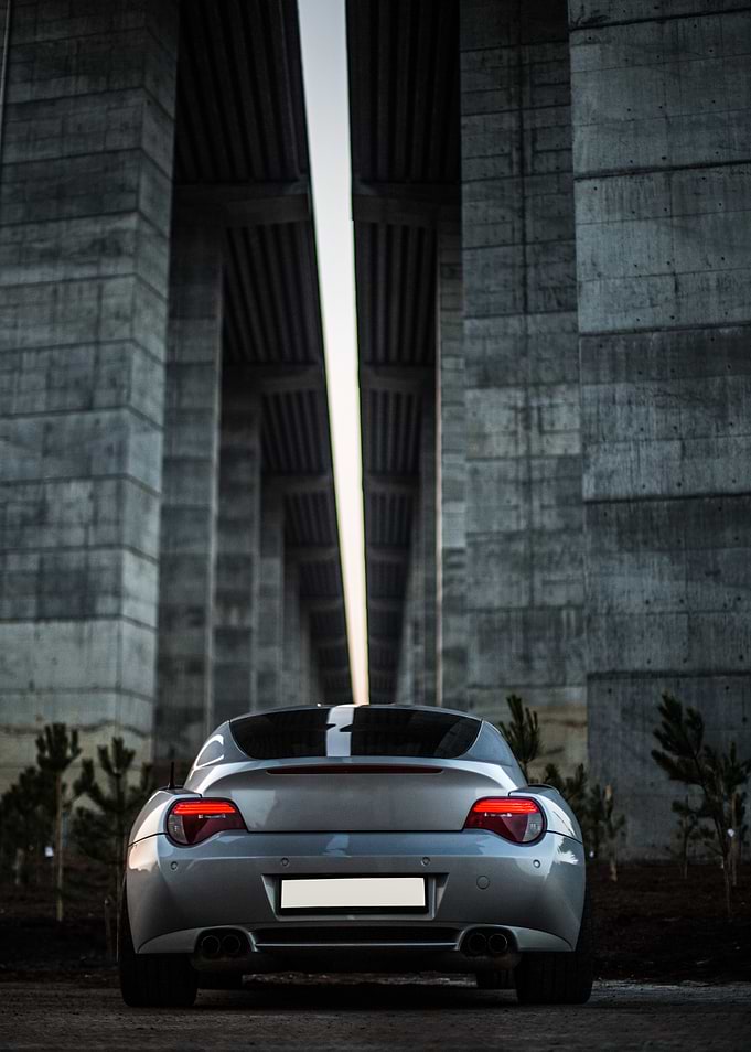 Silver Car Under Concrete Structure