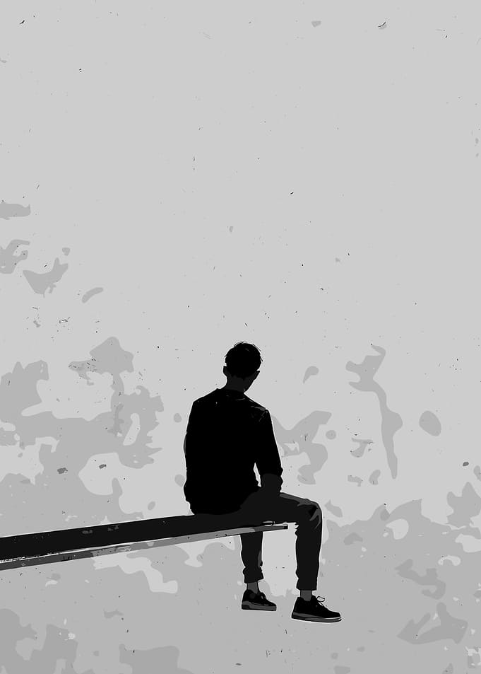 Monochrome Silhouette of a Seated Figure