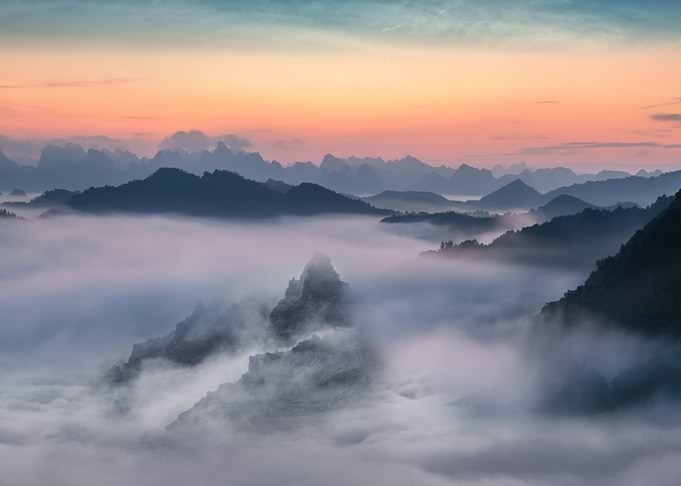 Misty Mountain Range at Sunrise