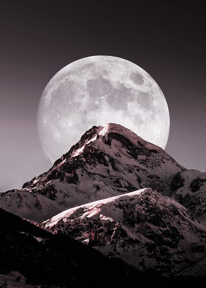 Mountain Peak Under a Full Moon