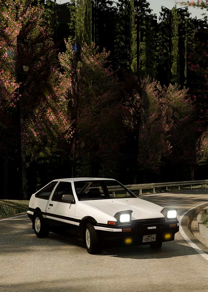 White AE86 on winding road