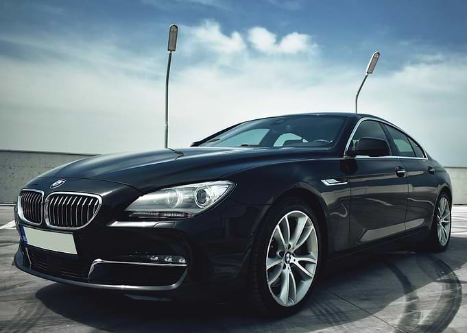 Black BMW on Rooftop Parking Lot