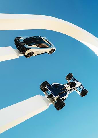 Two Cars on White Track in Sky