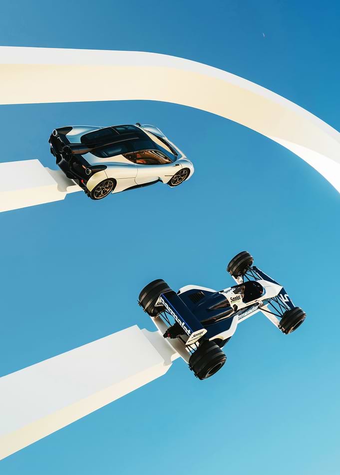 Two Cars on White Track in Sky