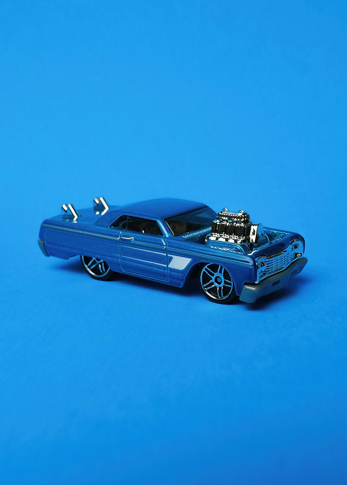 Blue Toy Car on Blue Background