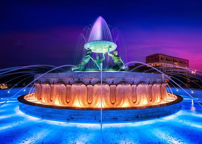 Triton Fountain in Malta at Sunset