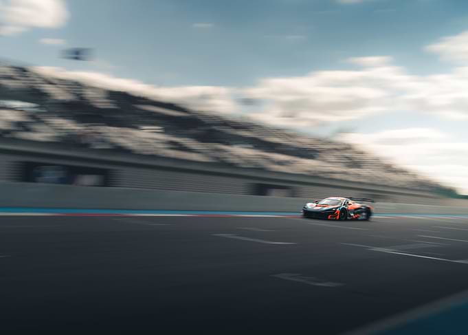 Racing car speeding on a track