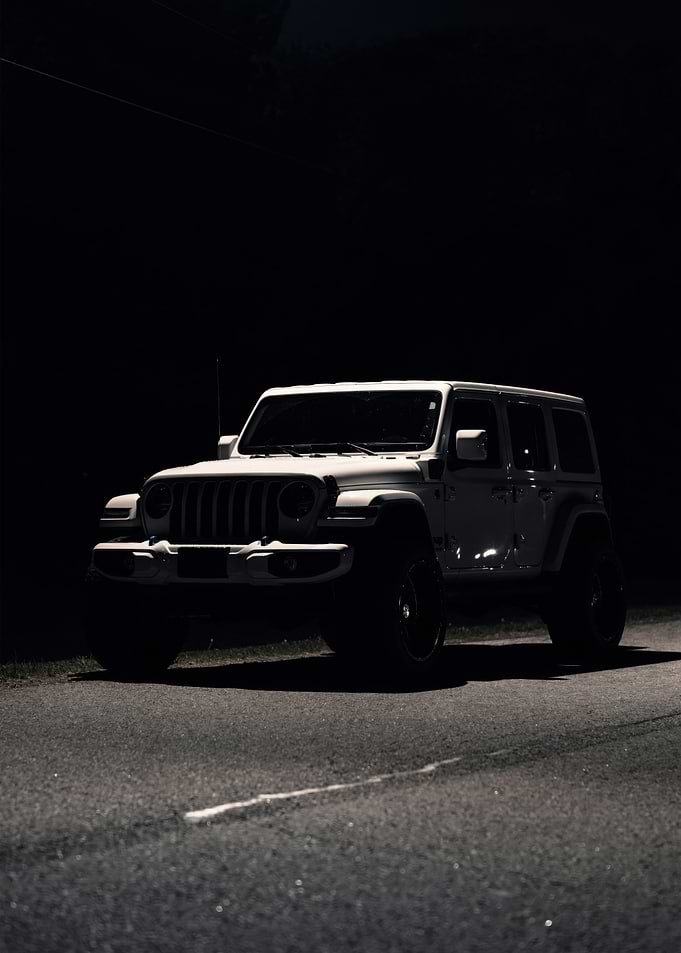 White Jeep Wrangler at Night