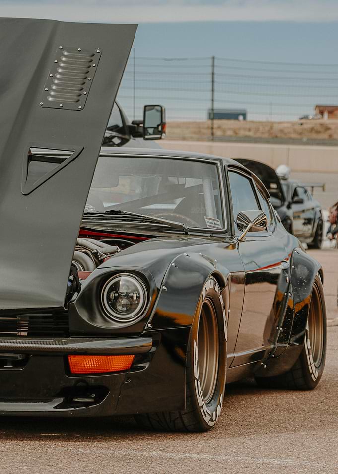Datsun 240Z Modified Black Sports Car with Open Hood