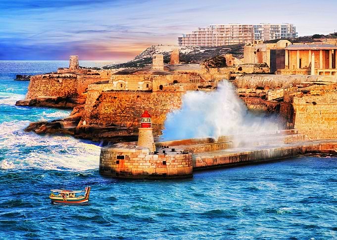 Valletta Lighthouse Breakwater at Sunset in Malta