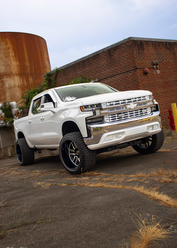 White Chevrolet Truck with Custom Wheels