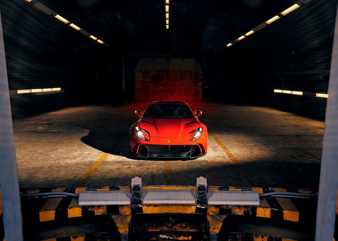 Red Sports Car in Dark Garage