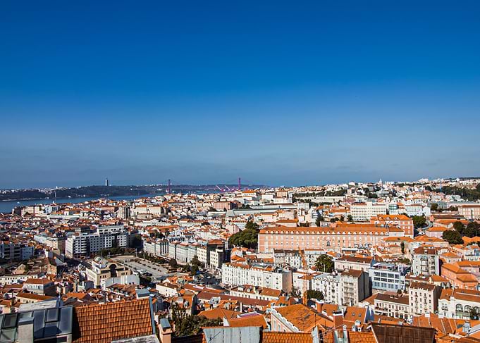 Lisbon cityscape under a clear blue sky