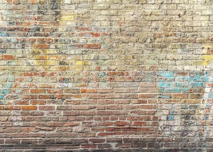 Distressed Brick Wall with Paint Splatters