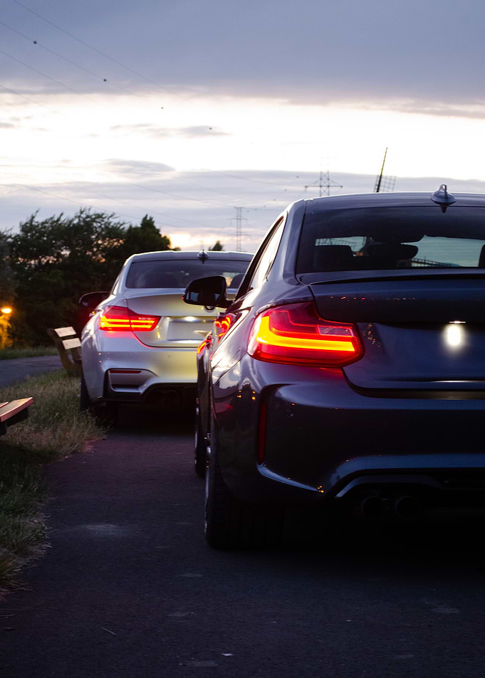 Two Cars Parked at Dusk
