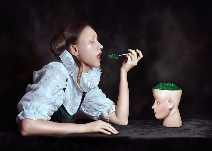 Woman in Ruff Collar Tasting Green Jelly from a Mannequin Head