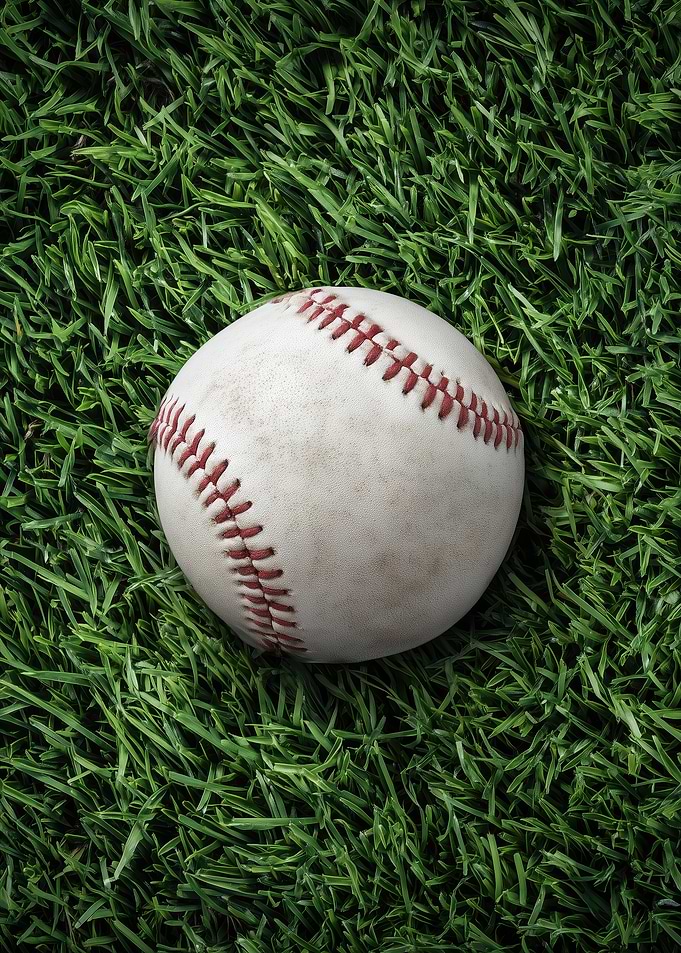 Baseball on Green Grass