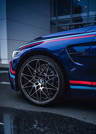 Blue BMW M4 with Racing Stripes