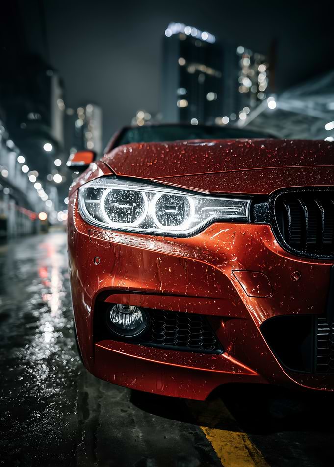 Red Car in Rainy Cityscape