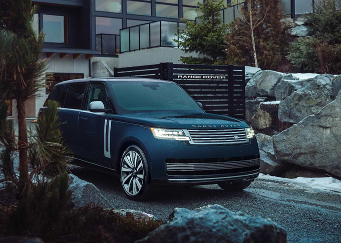 Blue Range Rover in a driveway
