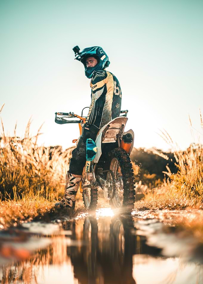 Motocross Rider in Muddy Field
