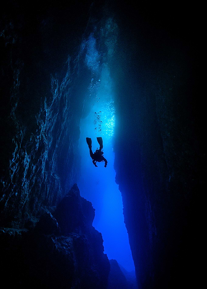 Deep Sea Diver in Underwater Cave