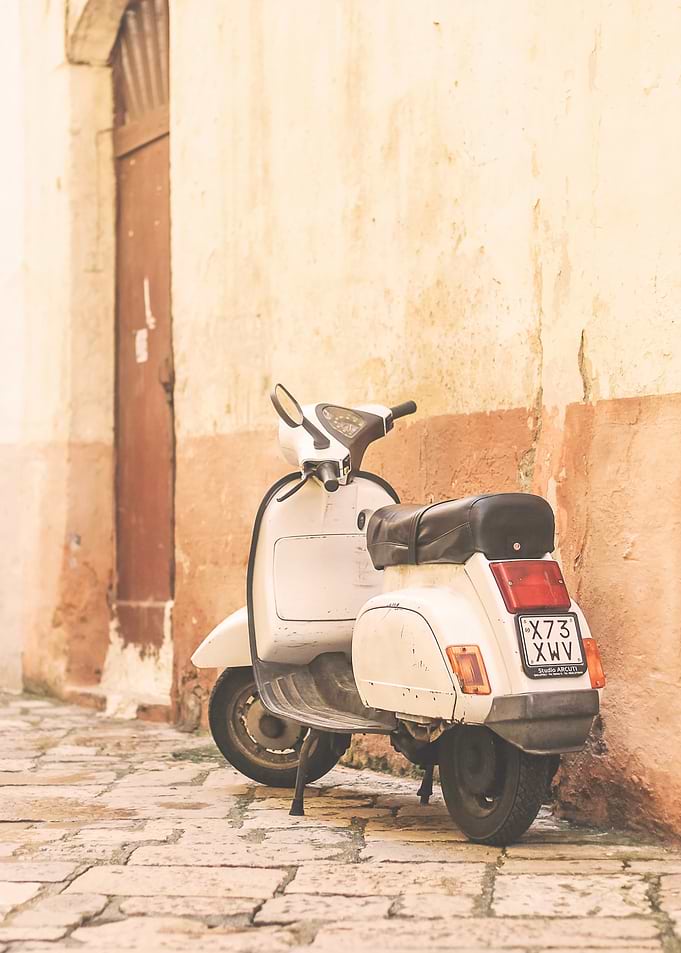 Puglia, Italy I Photography of a vintage scooter on a picturesque retro vintage Bari street Mediterranean capturing the essence of Italian streets with the authentic spirit of Italy