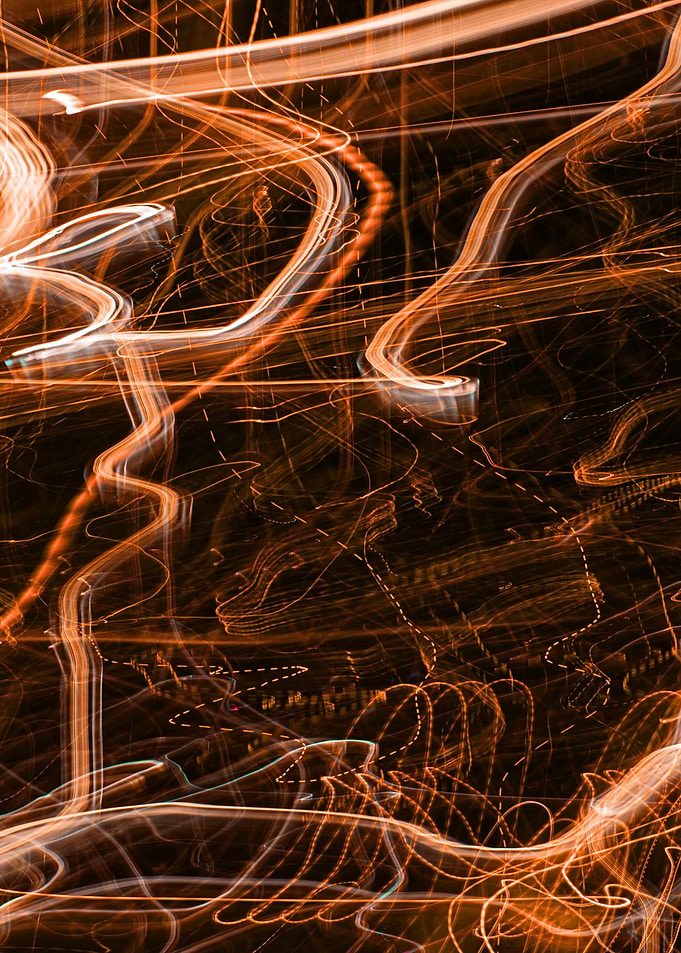 Abstract Orange Light Trails on Black